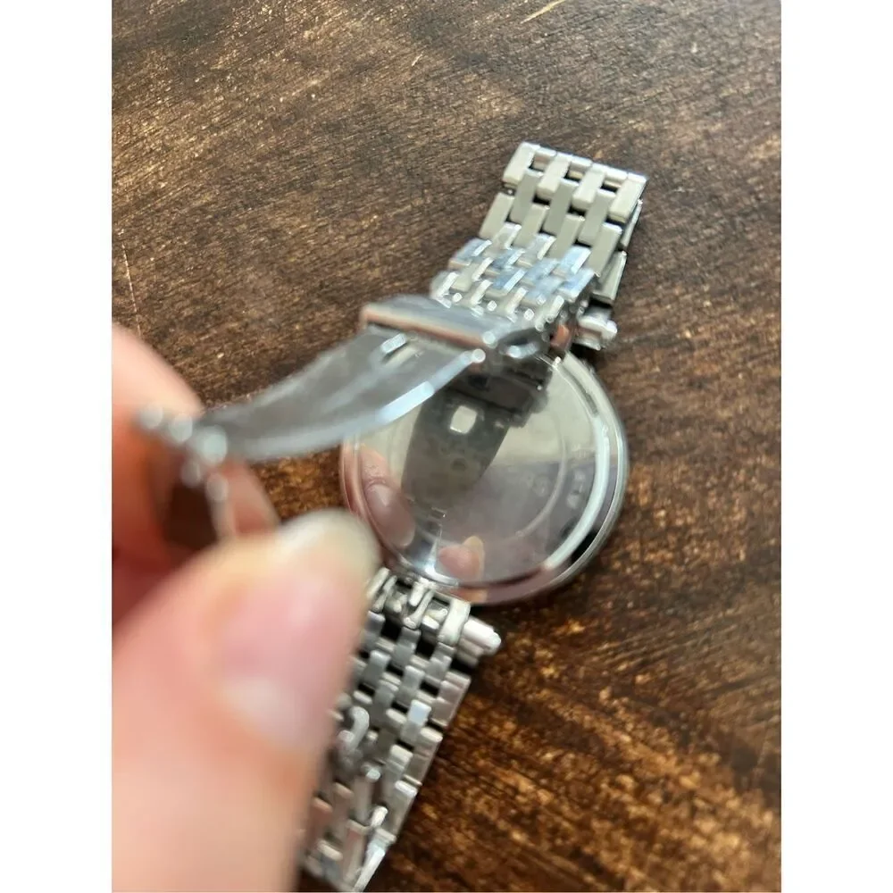 Michael Kors silver color faux diamond watch fits a small wrist 5 inches laying